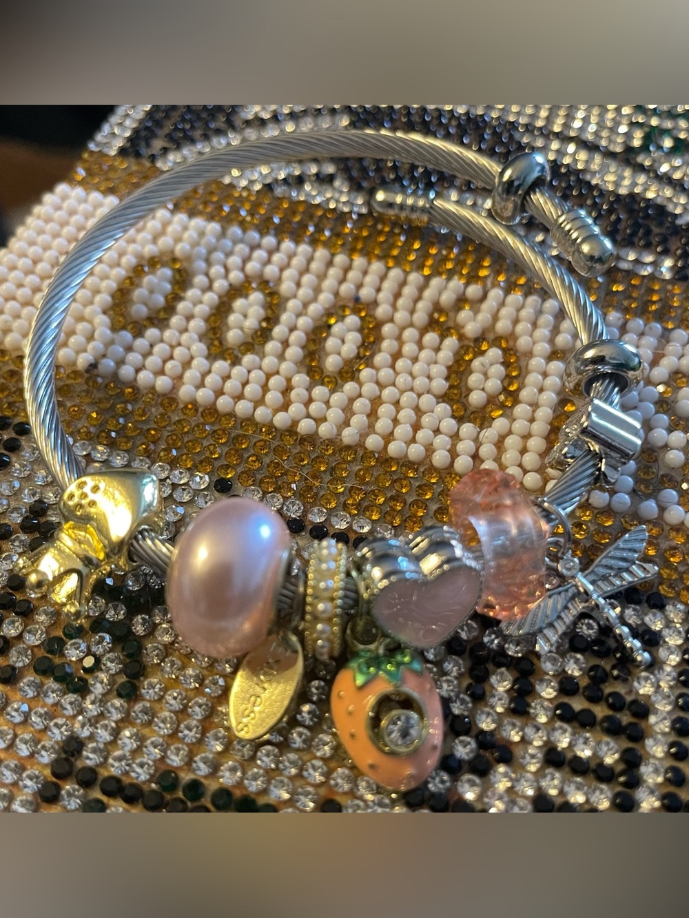 Silver Cable Bangle Bracelet with Pink and Peach Charms